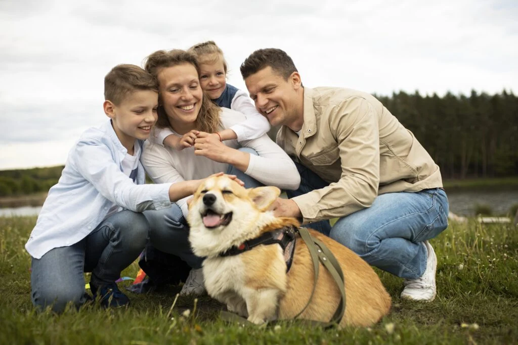 Family spending time outdoors with their dog